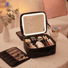 Portable LED makeup storage bag with illuminated mirror, adjustable compartments, large cosmetic organizer case for travel, skincare, and beauty accessories.
